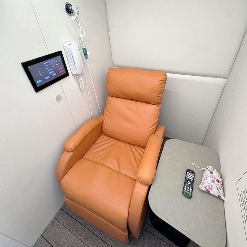single orange chair in pod