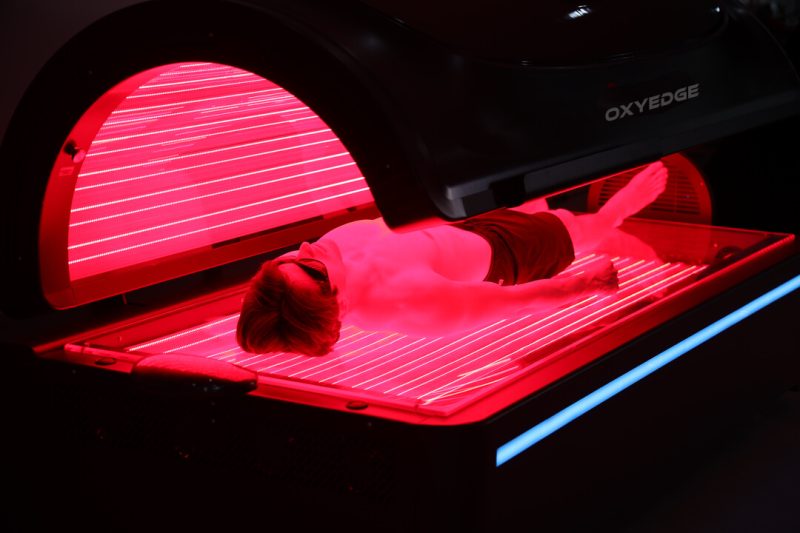 Person relaxing in tanning bed.