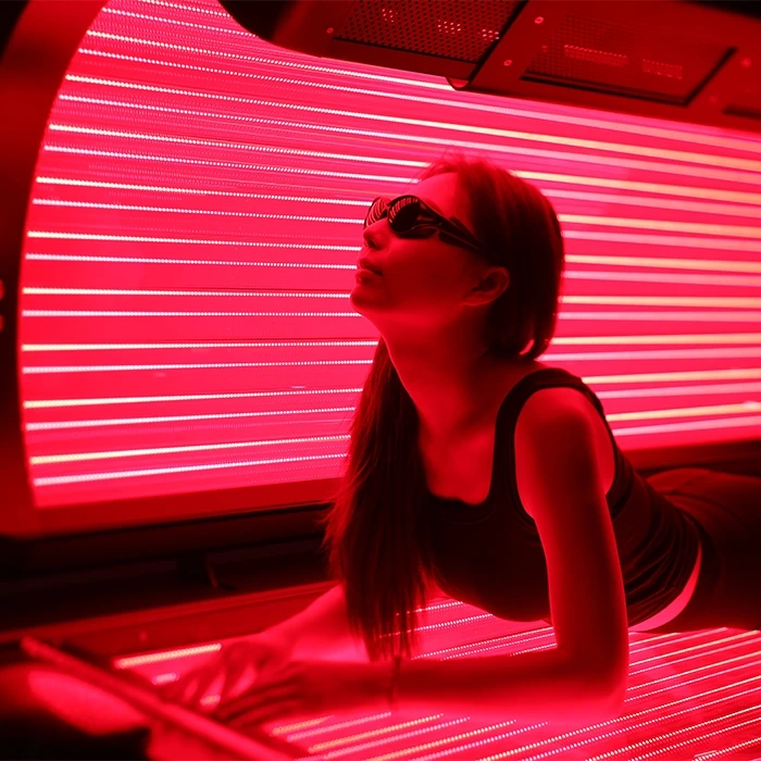 OxyEdge Red Light Bed on with girl inside